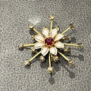 Red and white flower brooch
